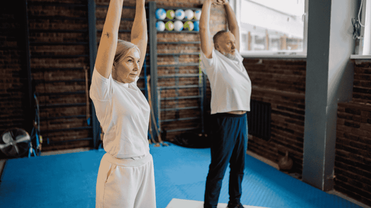 senior couple doing joint flexibility exercises
