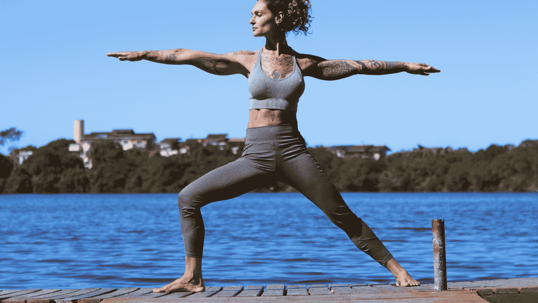 woman doing warrior yoga pose