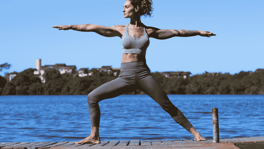 woman doing warrior yoga pose