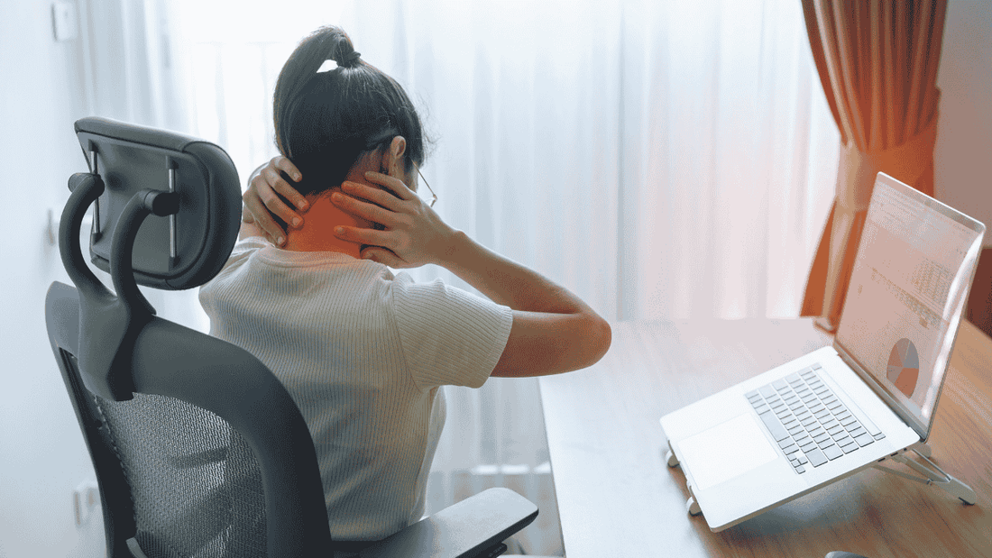 woman experiencing neck pain due to a poor ergonomic workstation